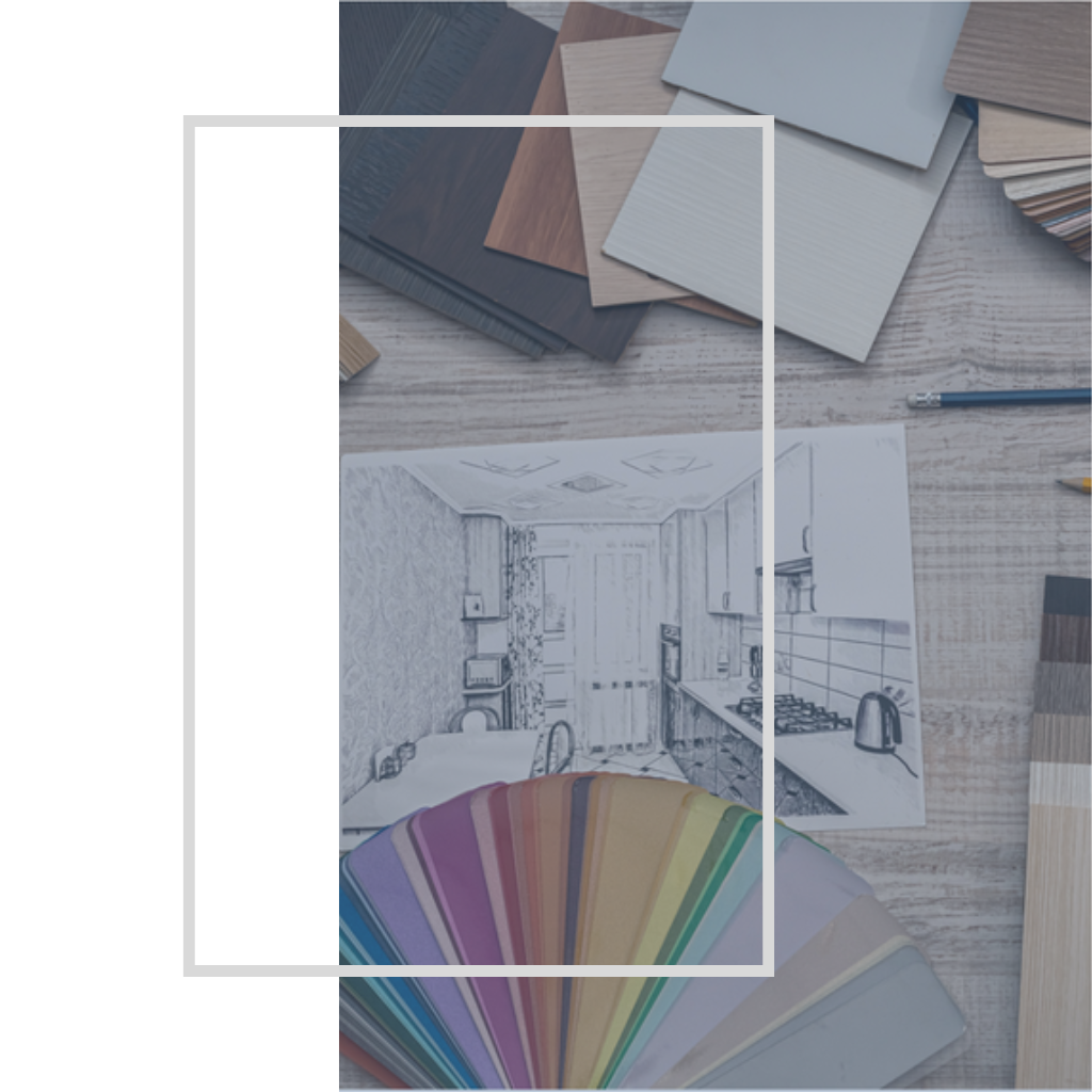 Imagen de una escritorio con muestras de papeles de diferentes colores y un dibujo